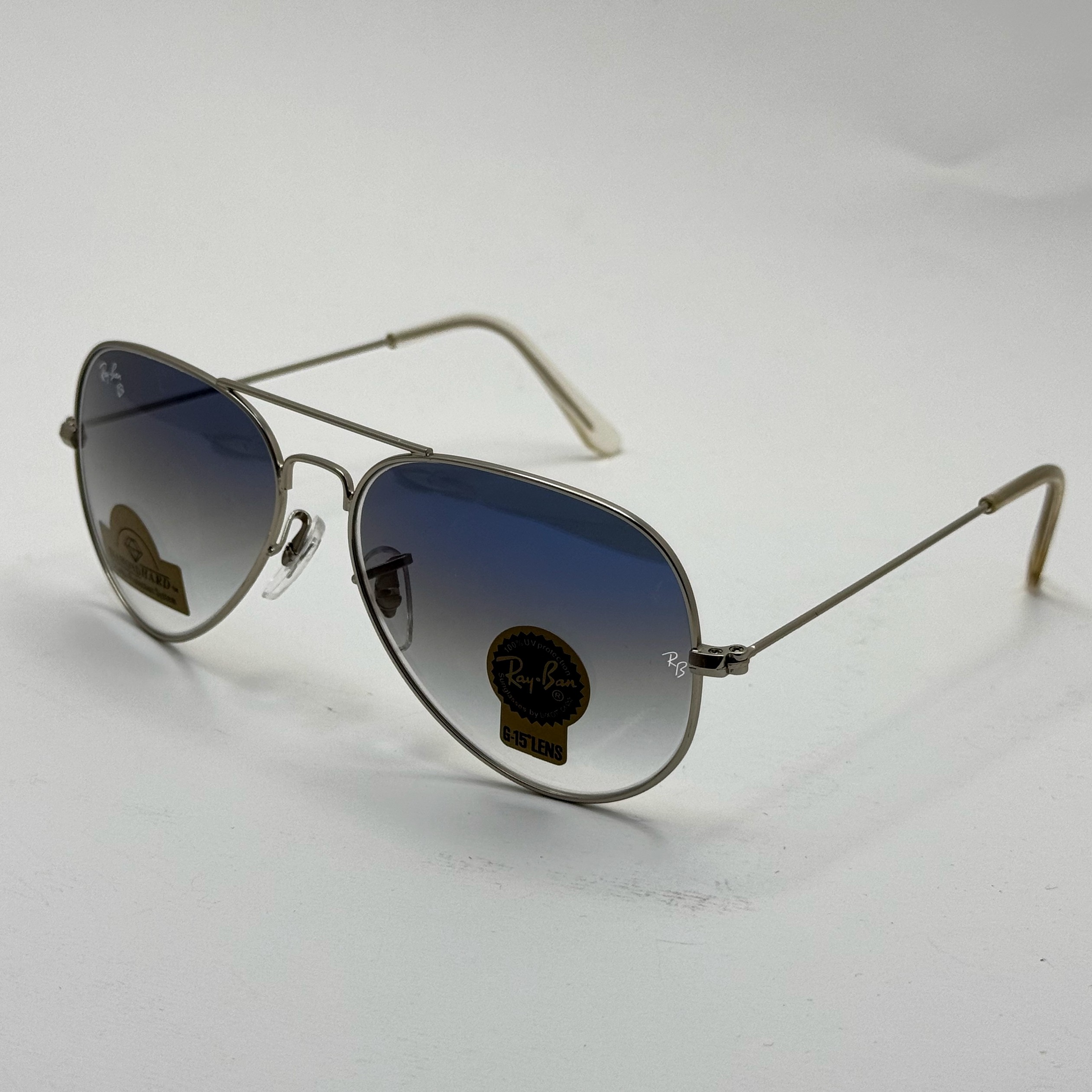 عینک ریبن خلبانی شیشه سنگ آبی هایلایت فریم نقره ای به همراه پک کامل ریبن Rayban RB 3025 (ارسال رایگان)